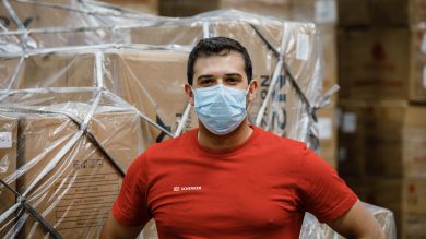 Warehouse employee wearing a mask