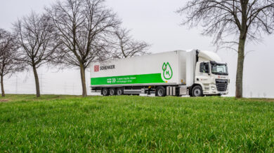 Hydrogen Truck drives in front of a meadow